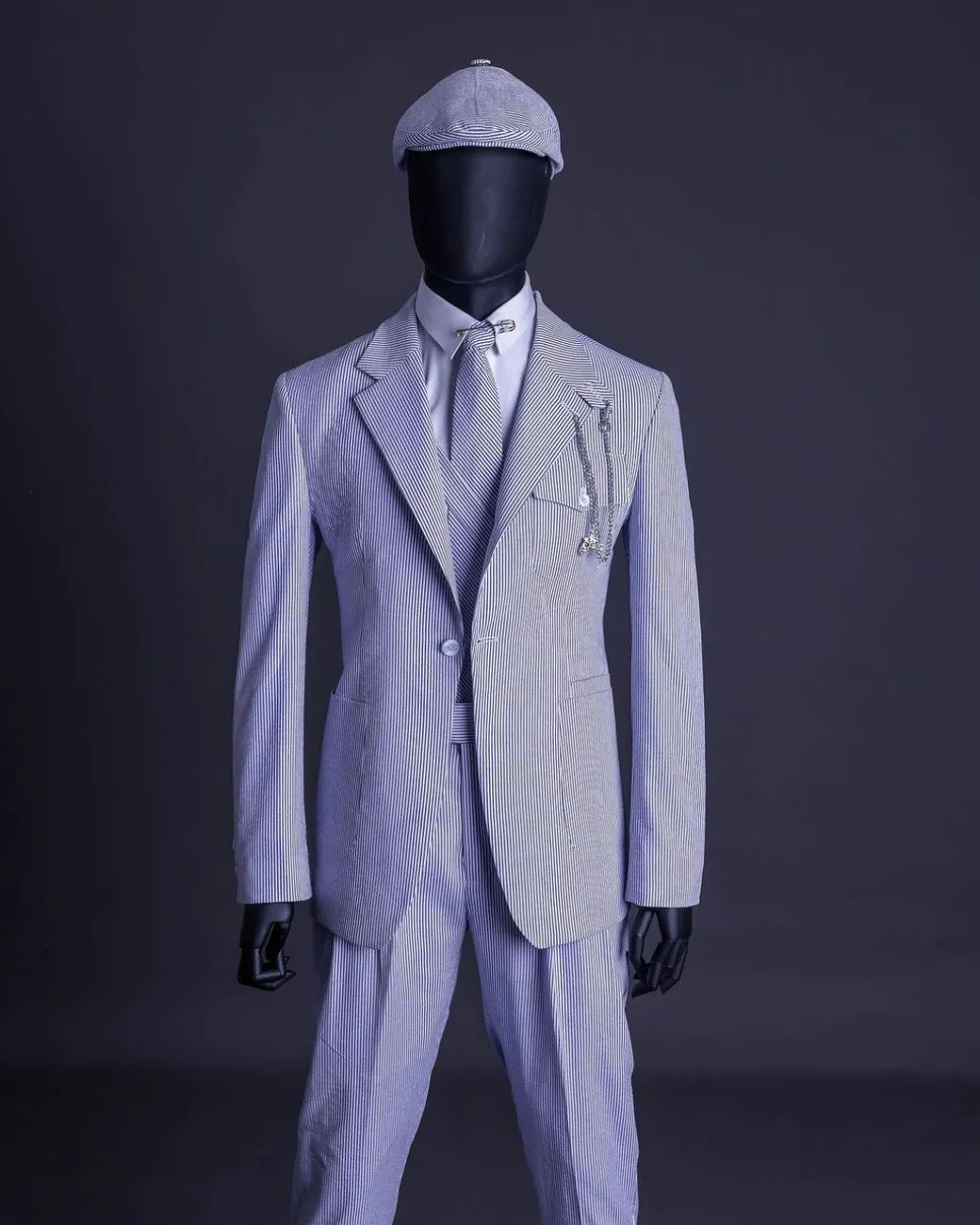 A monochrome seersucker (rail road stripe) notch lapel suit