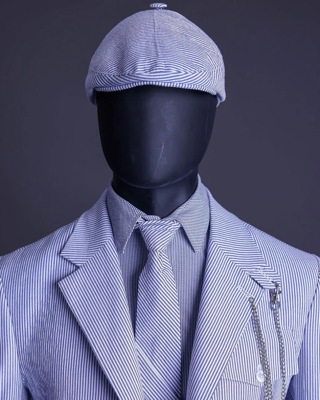 A monochrome seersucker (rail road stripe) notch lapel suit