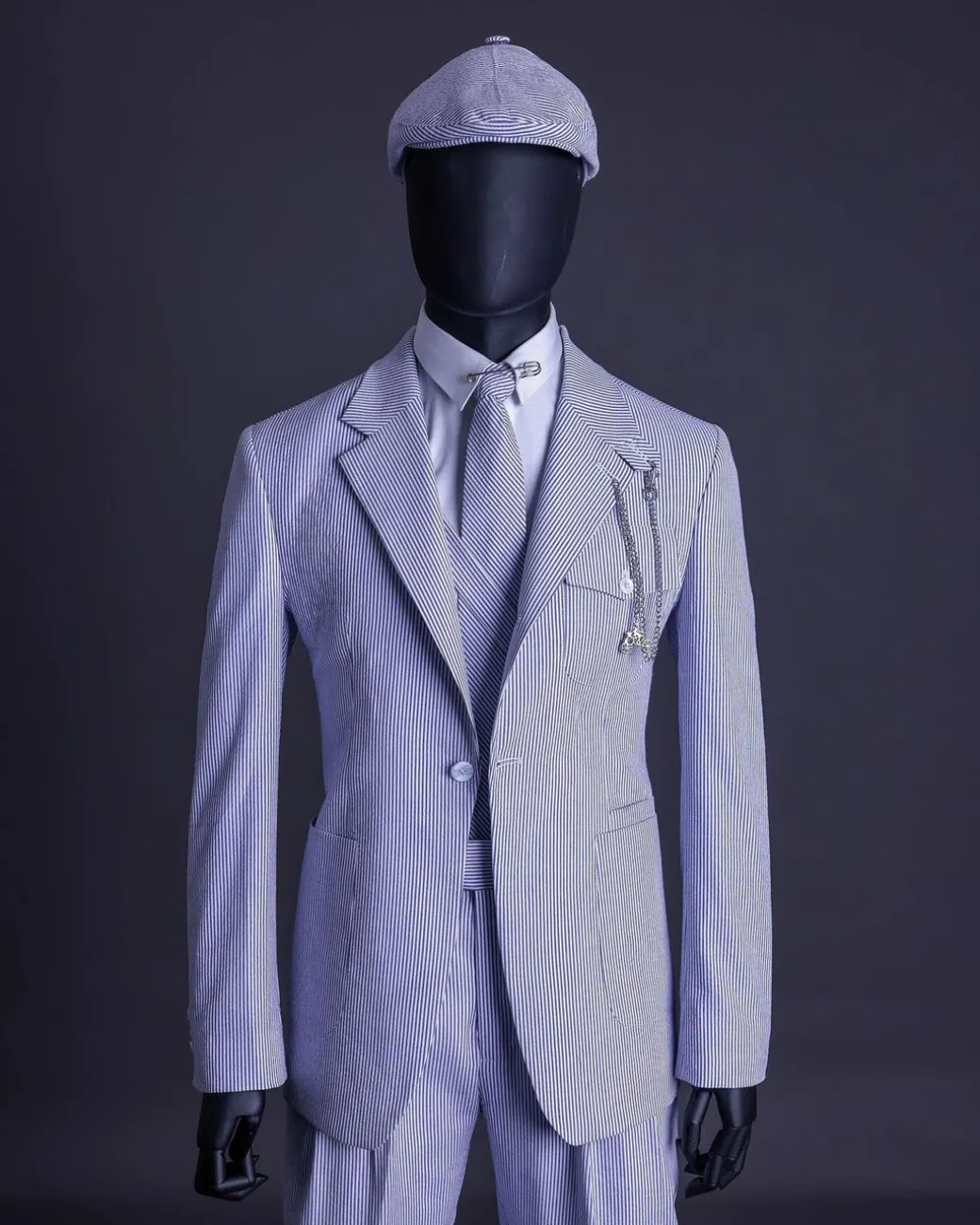 A monochrome seersucker (rail road stripe) notch lapel suit