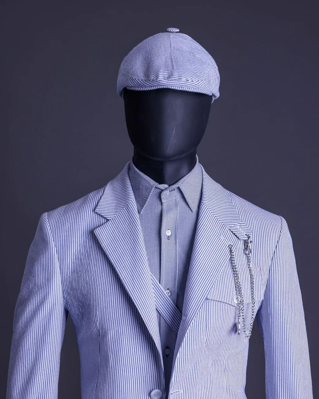 A monochrome seersucker (rail road stripe) notch lapel suit