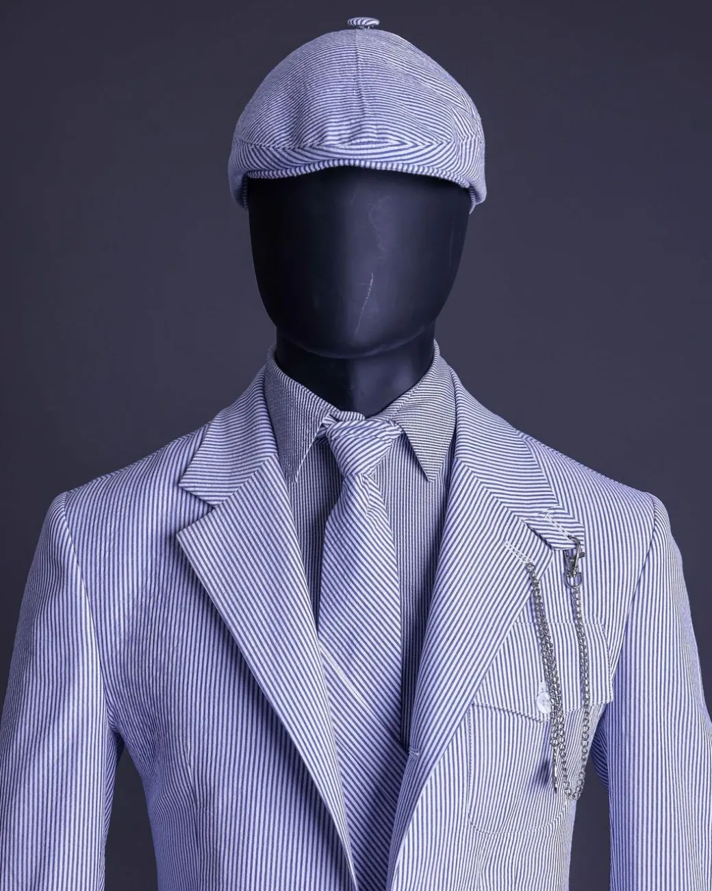 A monochrome seersucker (rail road stripe) notch lapel suit