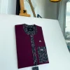 A Mulberry front flap with a clear view of a purple Swarovski button, a paisley-related purple flap and a pocket senator kaftan native