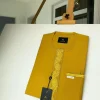 A Mustard Yellow Embroidery African kaftan with an interlocking lane design and sokoto