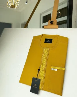 A Mustard Yellow Embroidery African kaftan with an interlocking lane design and sokoto