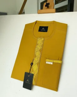 A Mustard Yellow Embroidery African kaftan with an interlocking lane design and sokoto