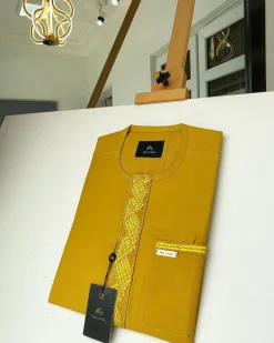 A Mustard Yellow Embroidery African kaftan with an interlocking lane design and sokoto