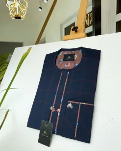 A Navy blue and Onion Check front flap with paisley detailing kaftan.