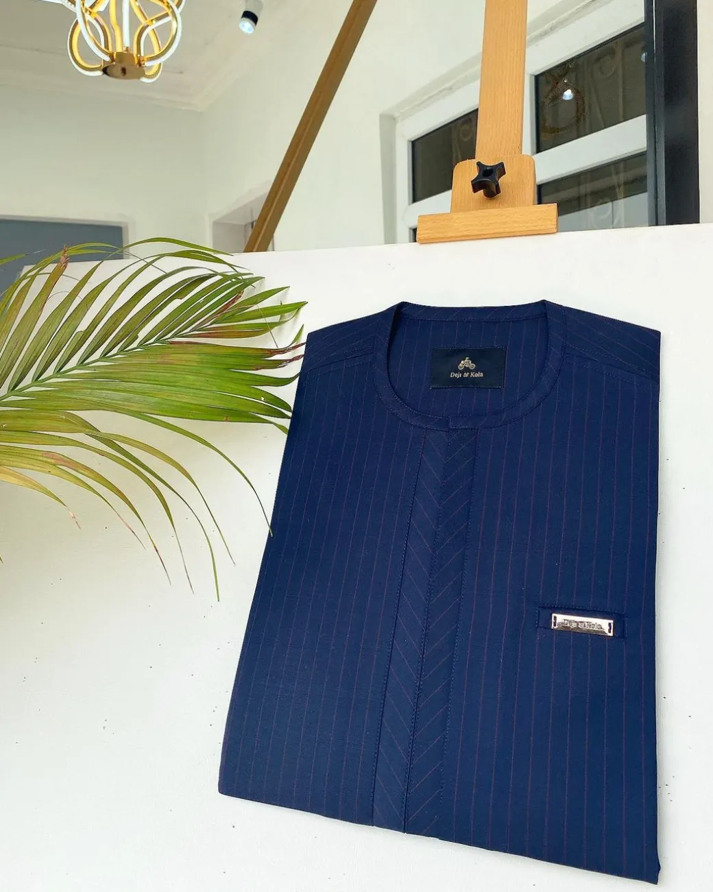 A Navy blue and red pinstripe African kaftan with an adjacent lane design and Sokoto
