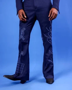 A Navy Blue “Anikulapo” High Waist, Trumpet Cut With Arewa Embroidery Details Pant With Side Metal Adjuster.