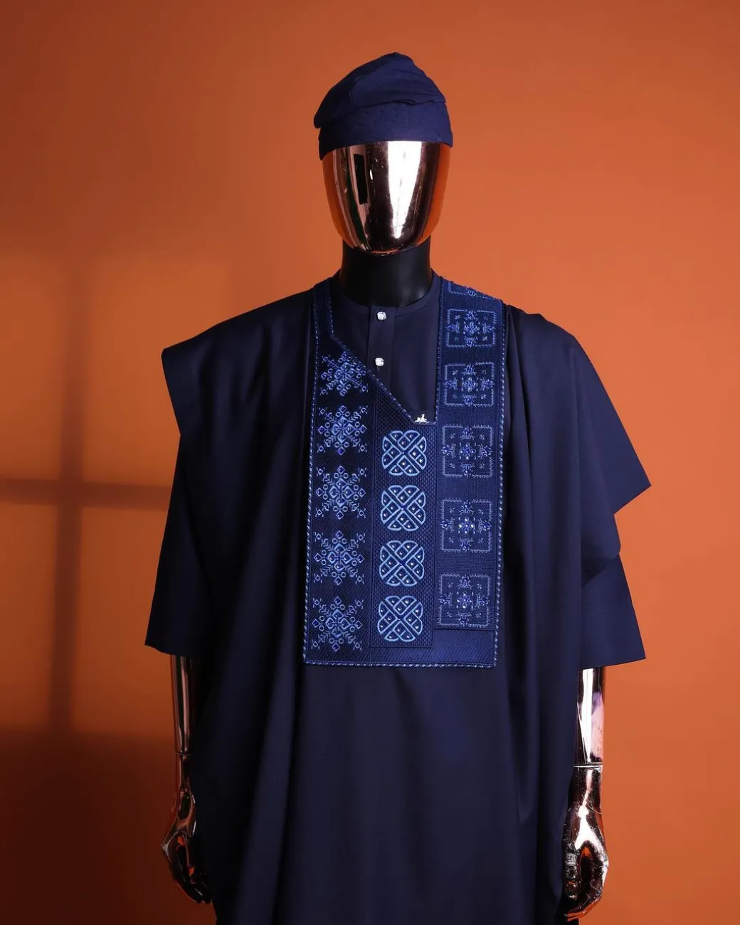 A navy blue, Arewa interwoven pattern embroidery details agbada, 3/4 sleeve kaftan & sokoto