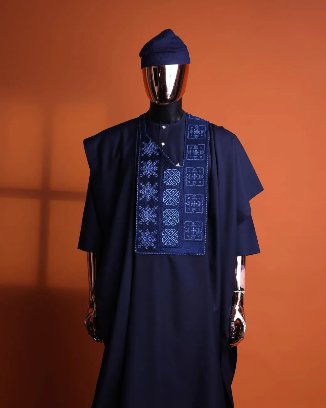 A navy blue, Arewa interwoven pattern embroidery details agbada, 3/4 sleeve kaftan & sokoto