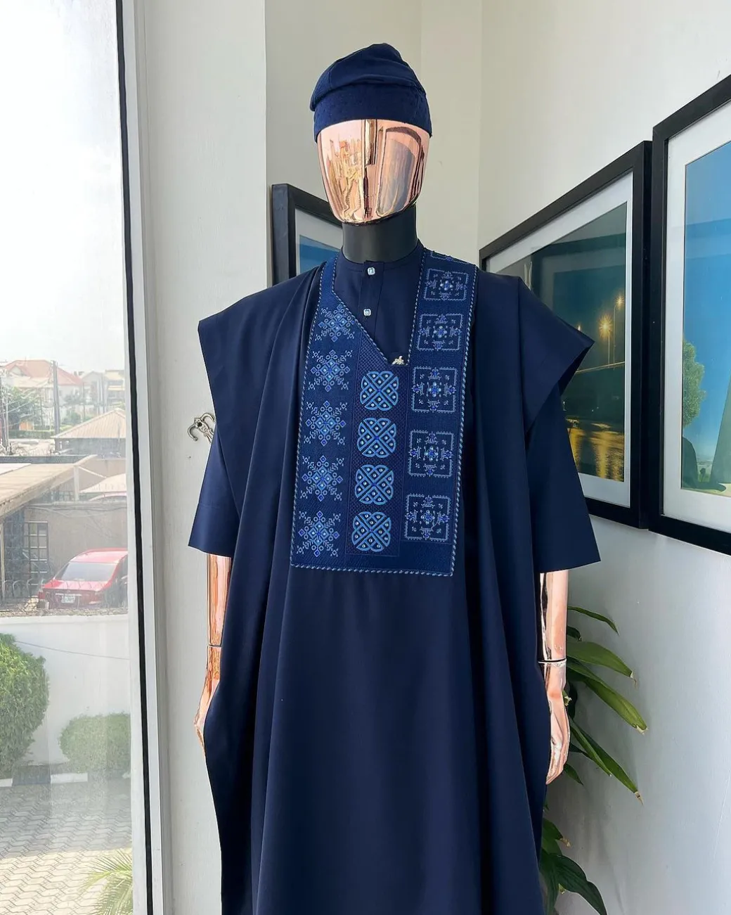 A navy blue, Arewa interwoven pattern embroidery details agbada, 3/4 sleeve kaftan & sokoto