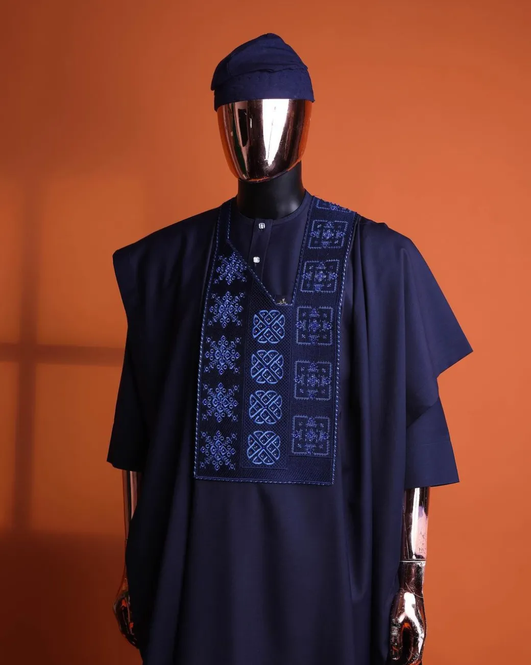 A navy blue, Arewa interwoven pattern embroidery details agbada, 3/4 sleeve kaftan & sokoto