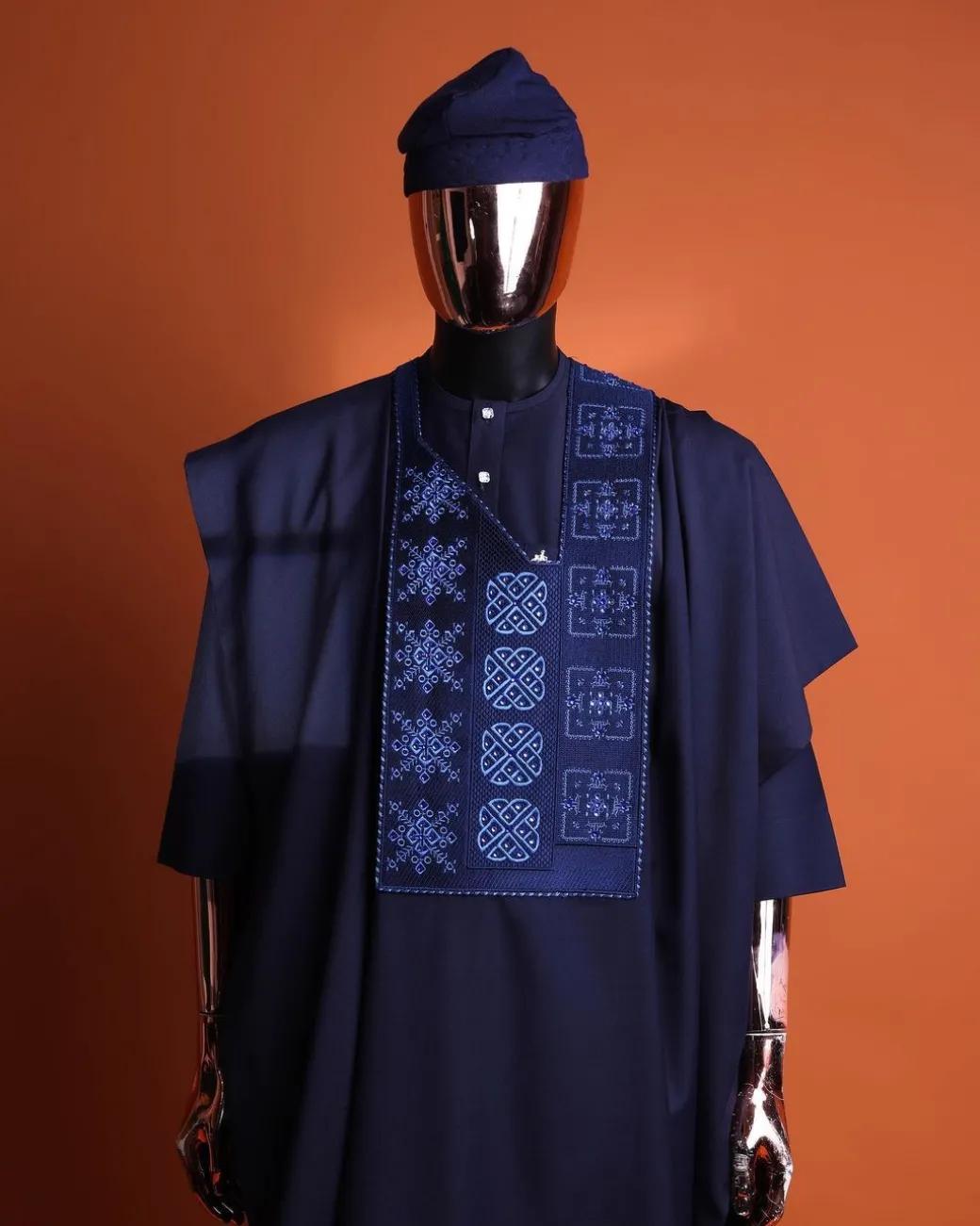 A navy blue, Arewa interwoven pattern embroidery details agbada, 3/4 sleeve kaftan & sokoto