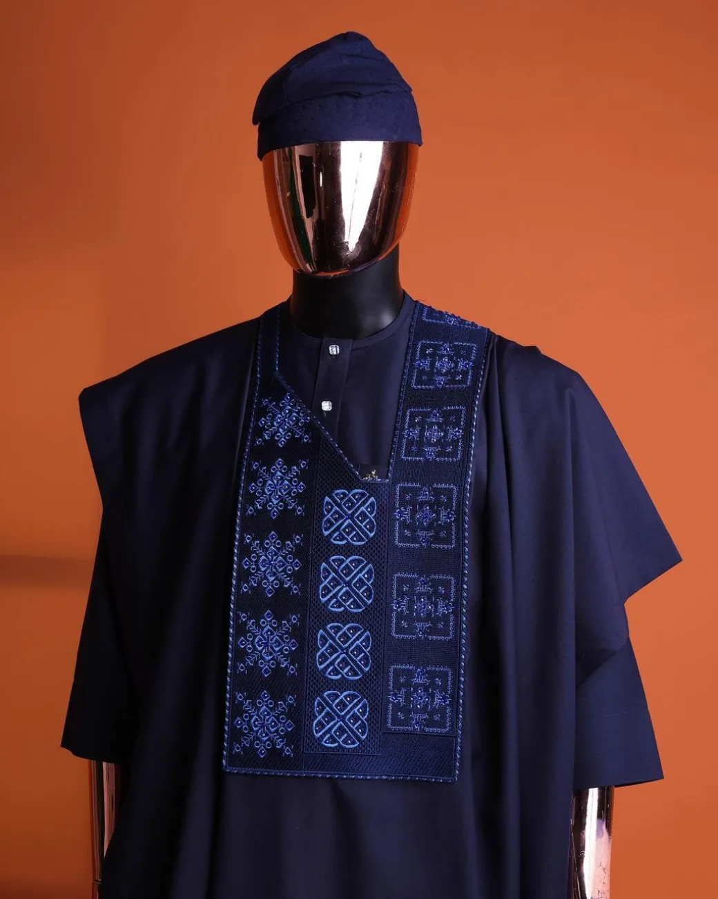A navy blue, Arewa interwoven pattern embroidery details agbada, 3/4 sleeve kaftan & sokoto