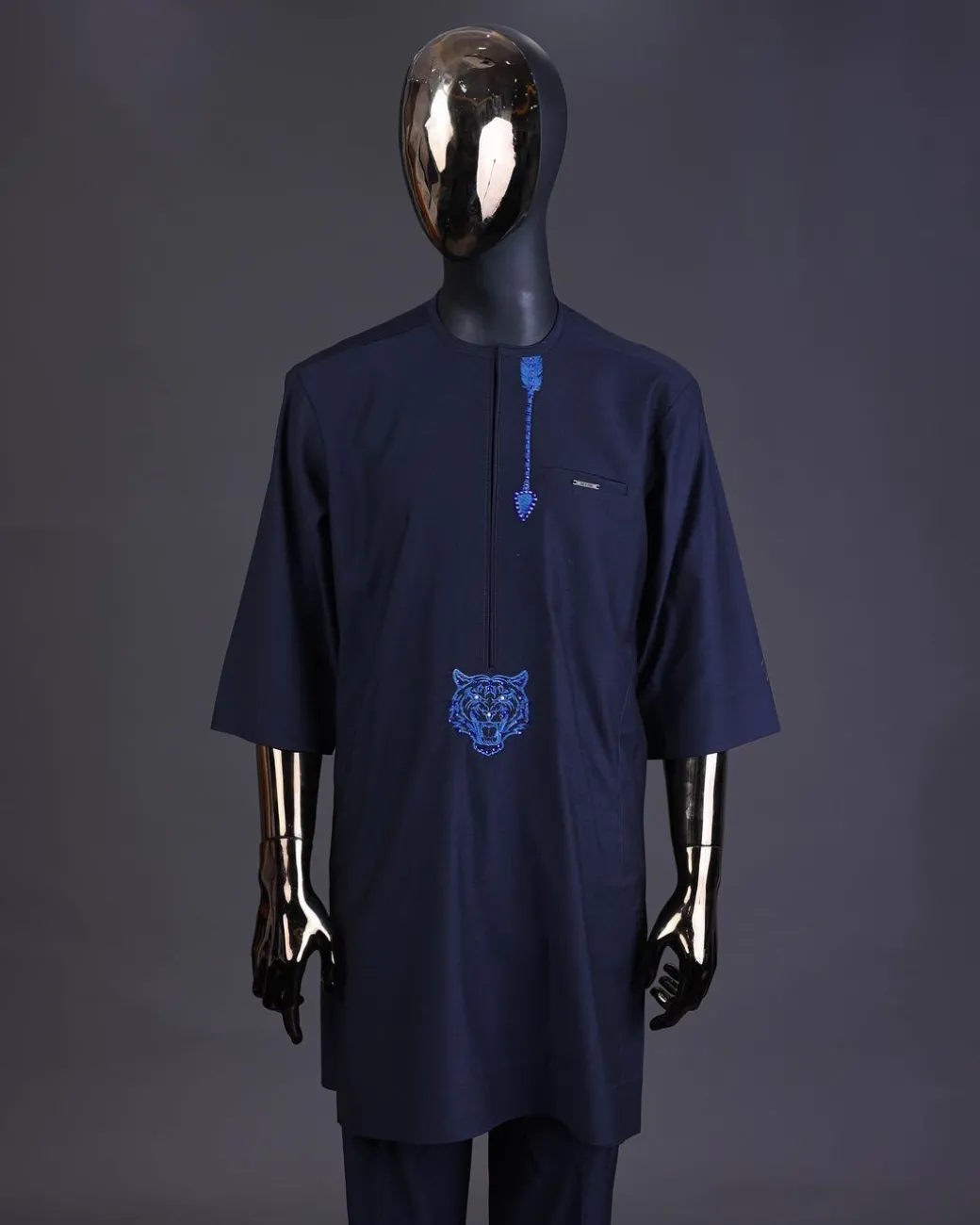 A Navy blue arrow and tiger head embroidery detail with matching Swarovski stone kaftan and Sokoto