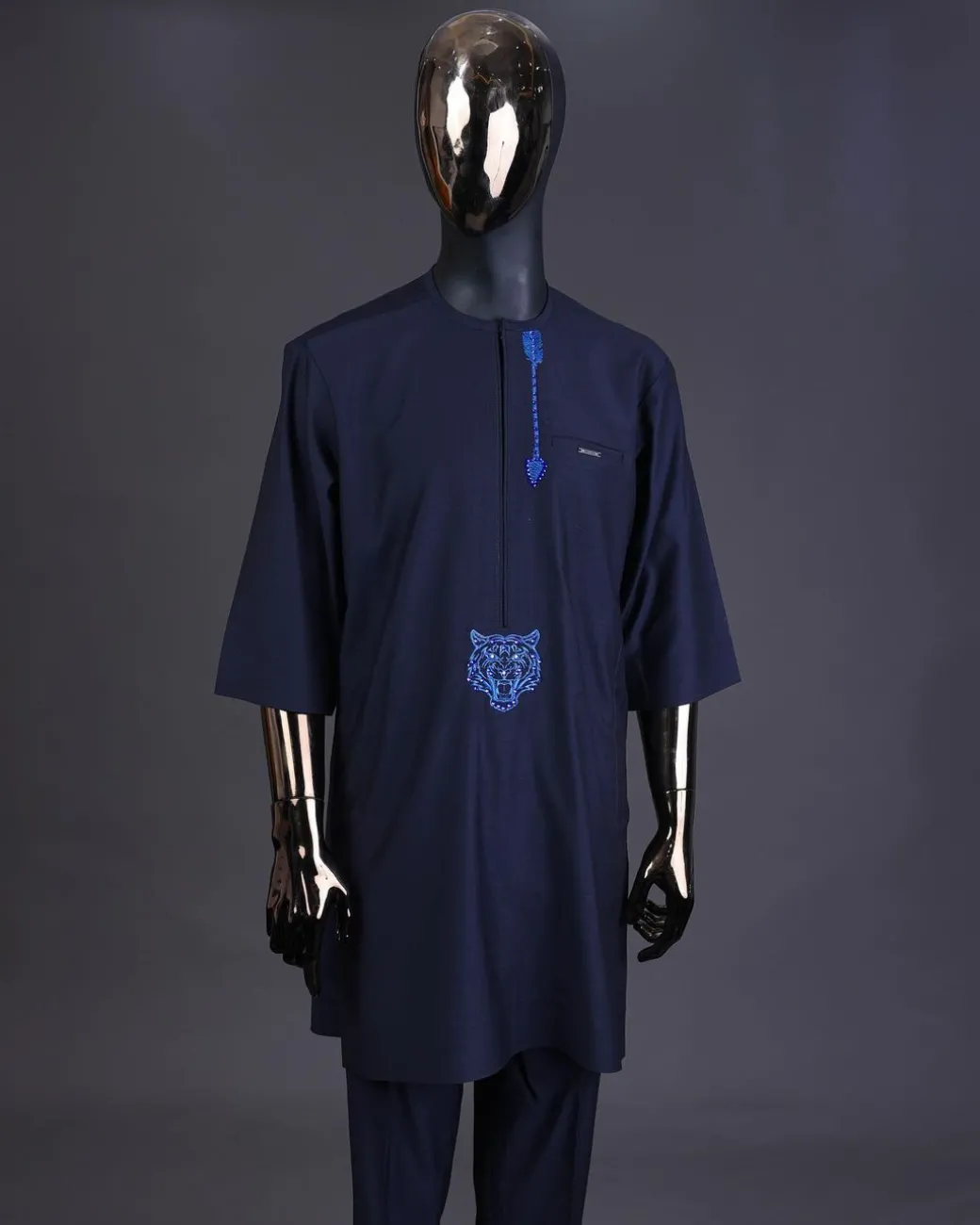 A Navy blue arrow and tiger head embroidery detail with matching Swarovski stone kaftan and Sokoto