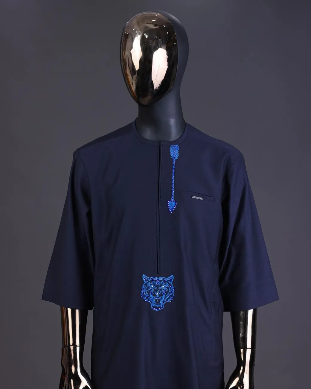 A Navy blue arrow and tiger head embroidery detail with matching Swarovski stone kaftan and Sokoto