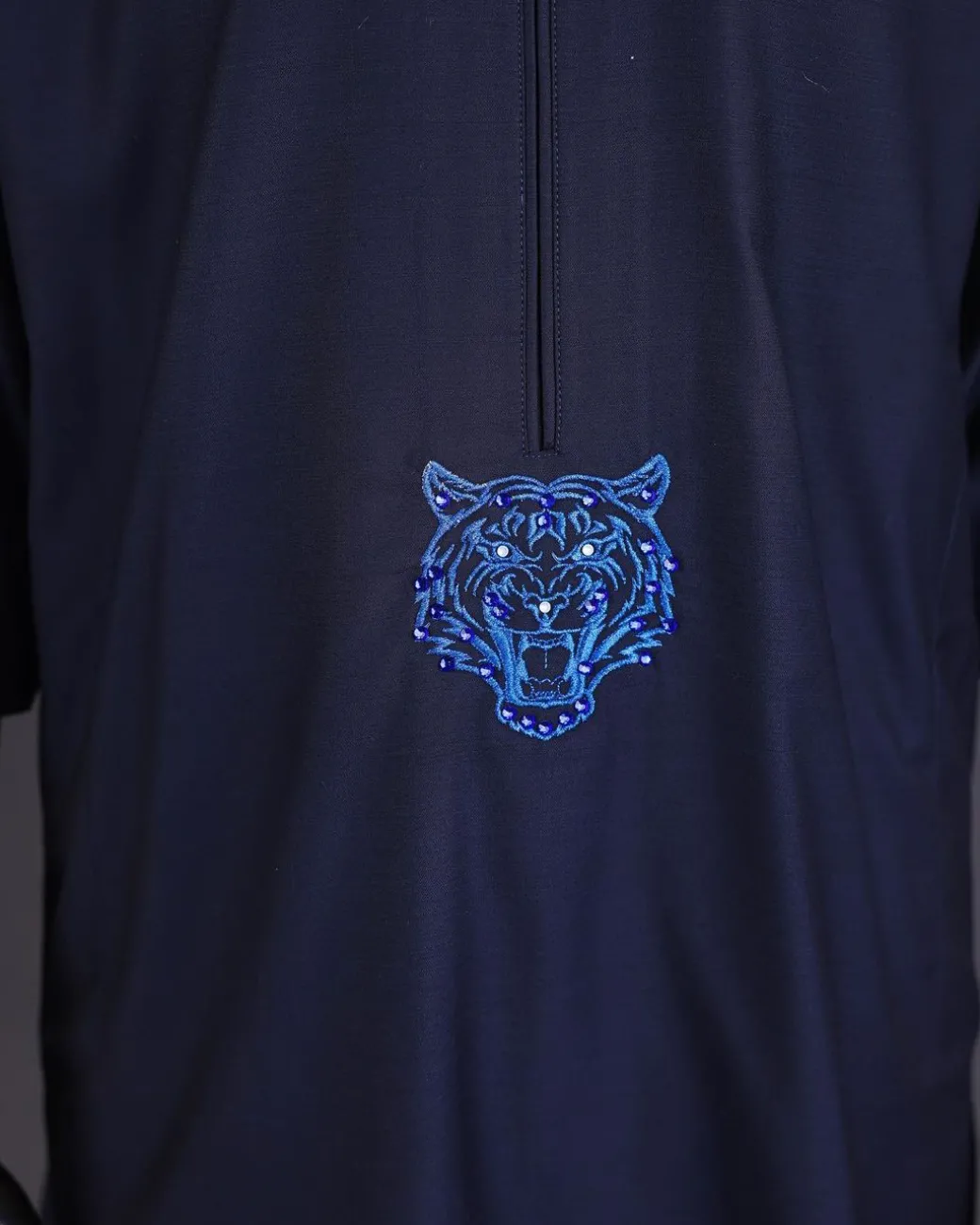 A Navy blue arrow and tiger head embroidery detail with matching Swarovski stone kaftan and Sokoto