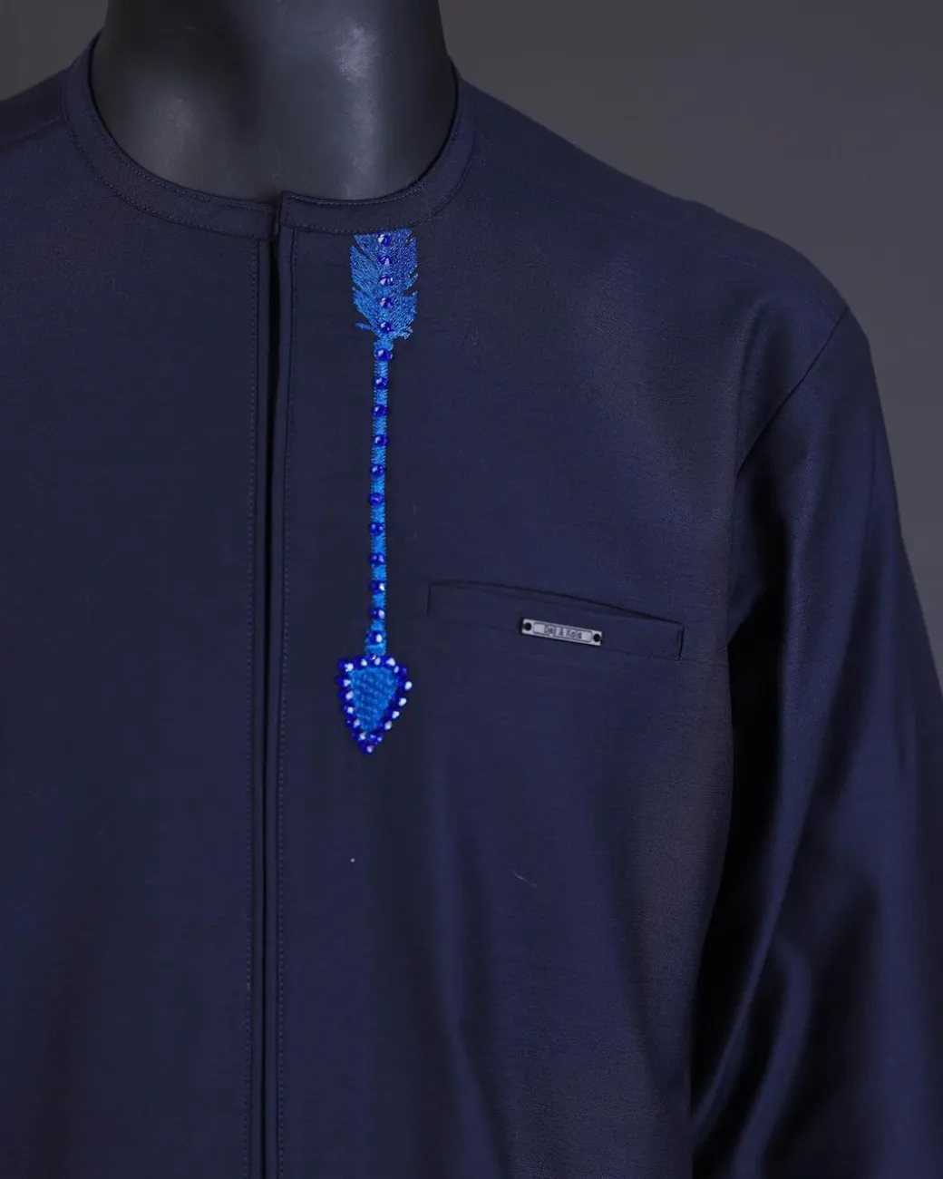 A Navy blue arrow and tiger head embroidery detail with matching Swarovski stone kaftan and Sokoto