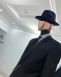 A Navy Blue Bowlers Hat with feathers detailings and Design