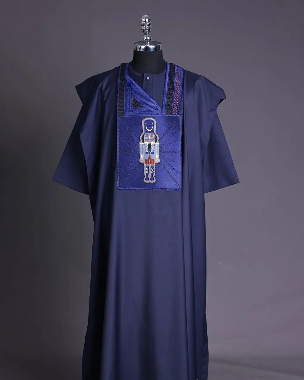A Navy blue, central head of pagoda embroidery details agbada
