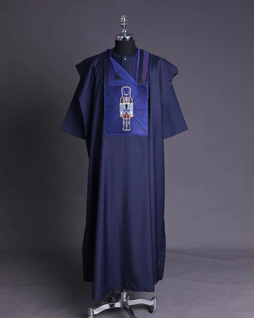 A Navy blue, central head of pagoda embroidery details agbada