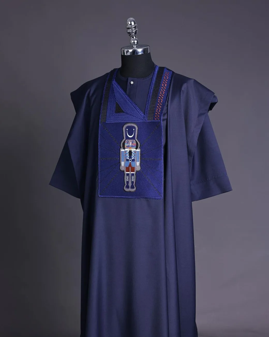 A Navy blue, central head of pagoda embroidery details agbada