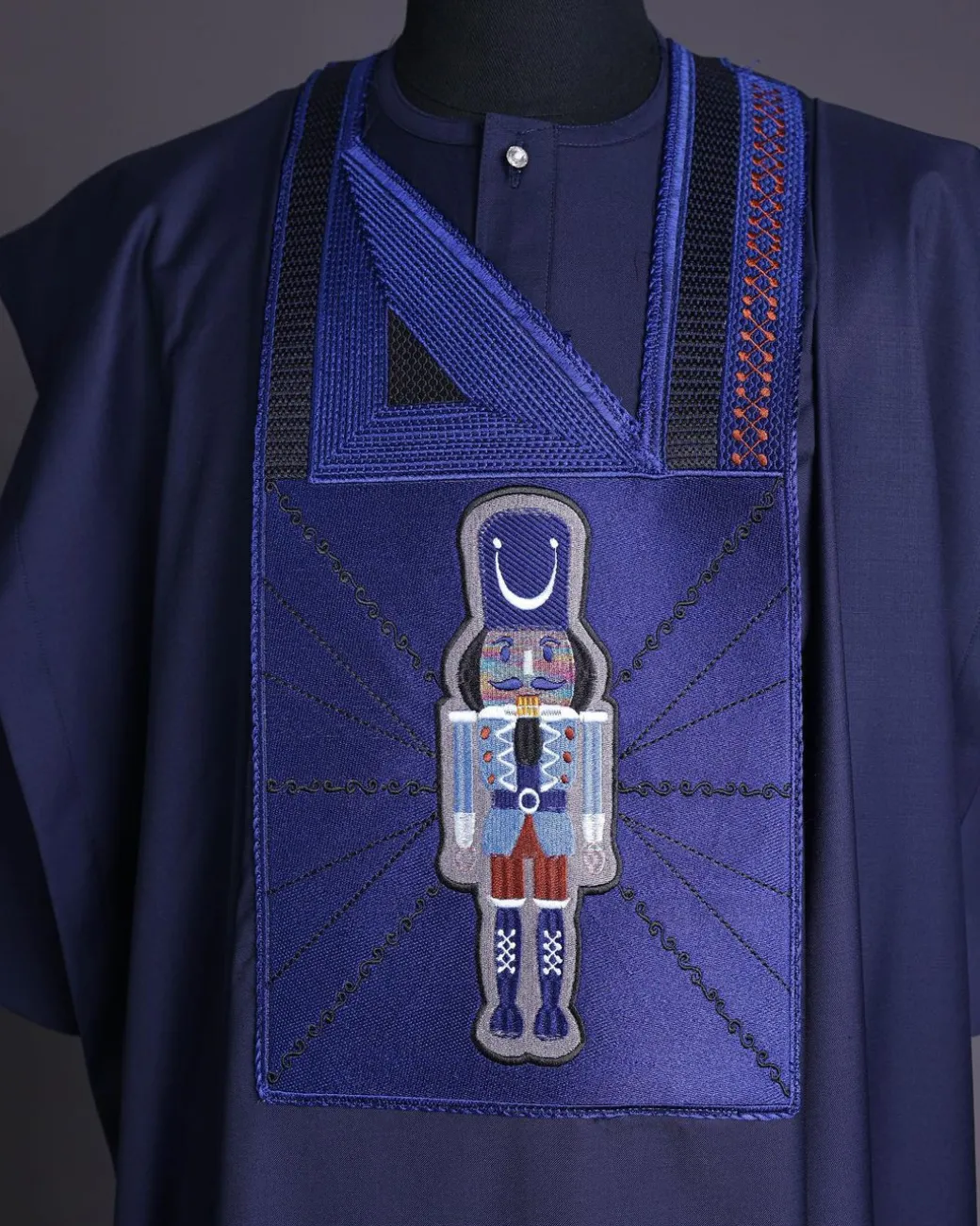 A Navy blue, central head of pagoda embroidery details agbada
