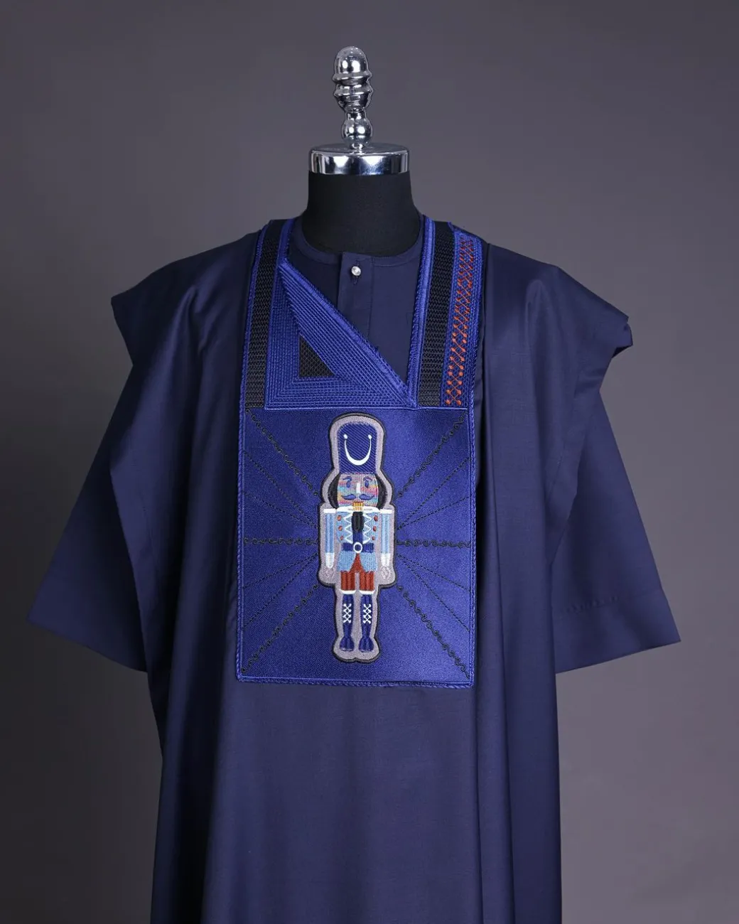 A Navy blue, central head of pagoda embroidery details agbada