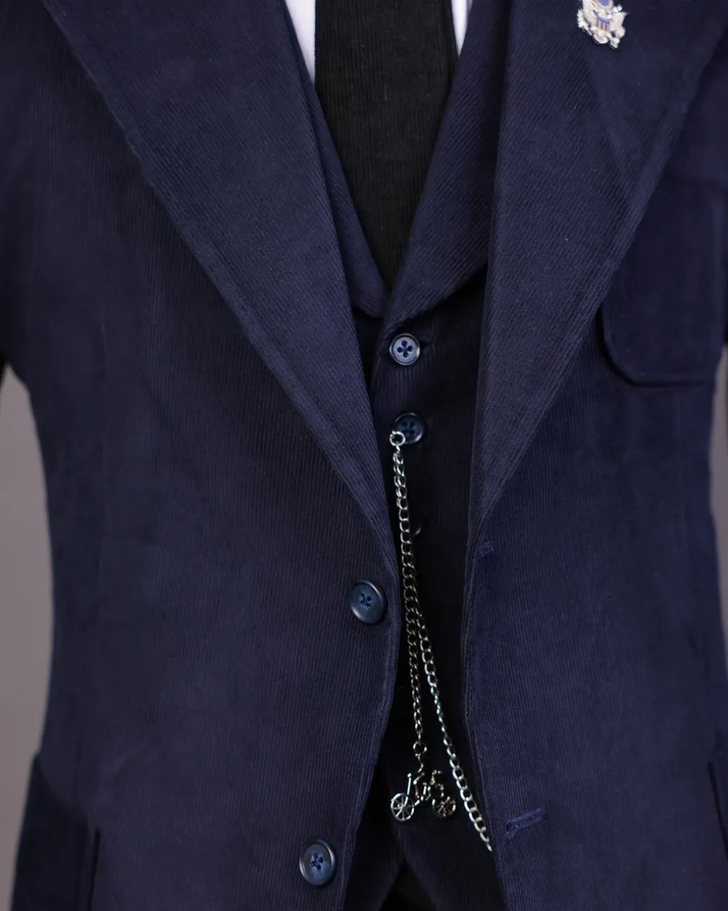 A Navy Blue Corduroy, notch lapel, patch pocket 2 button suit