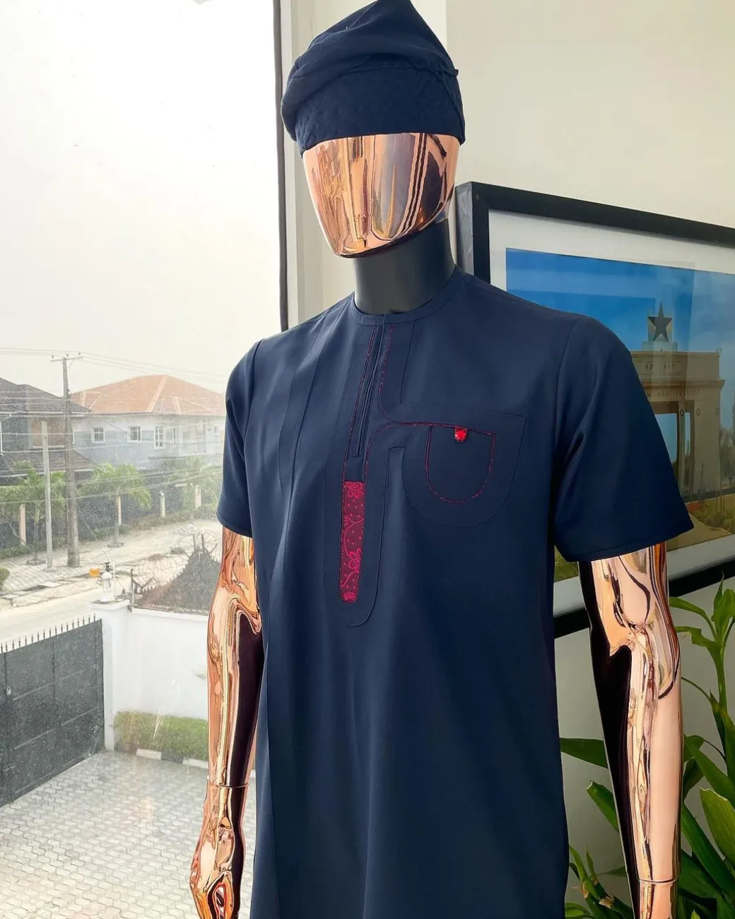 A Navy blue, curly connected with wine paisley detailing african traditional senator kaftan native.