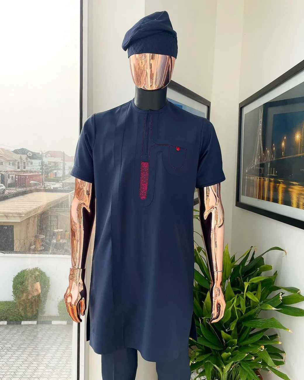 A Navy blue, curly connected with wine paisley detailing african traditional senator kaftan native.