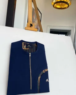 A Navy blue, curved rainbow pocket, gold zip line detailing African traditional senator kaftan