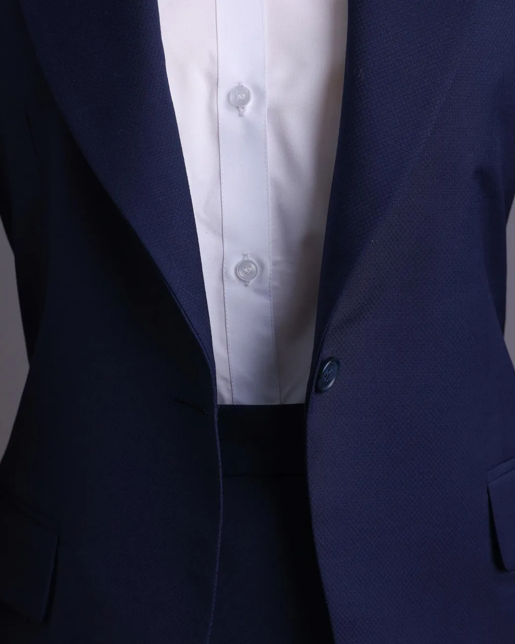 A Navy Blue, dotted pattern, nobility wool blend, business-wide notch lapel suit