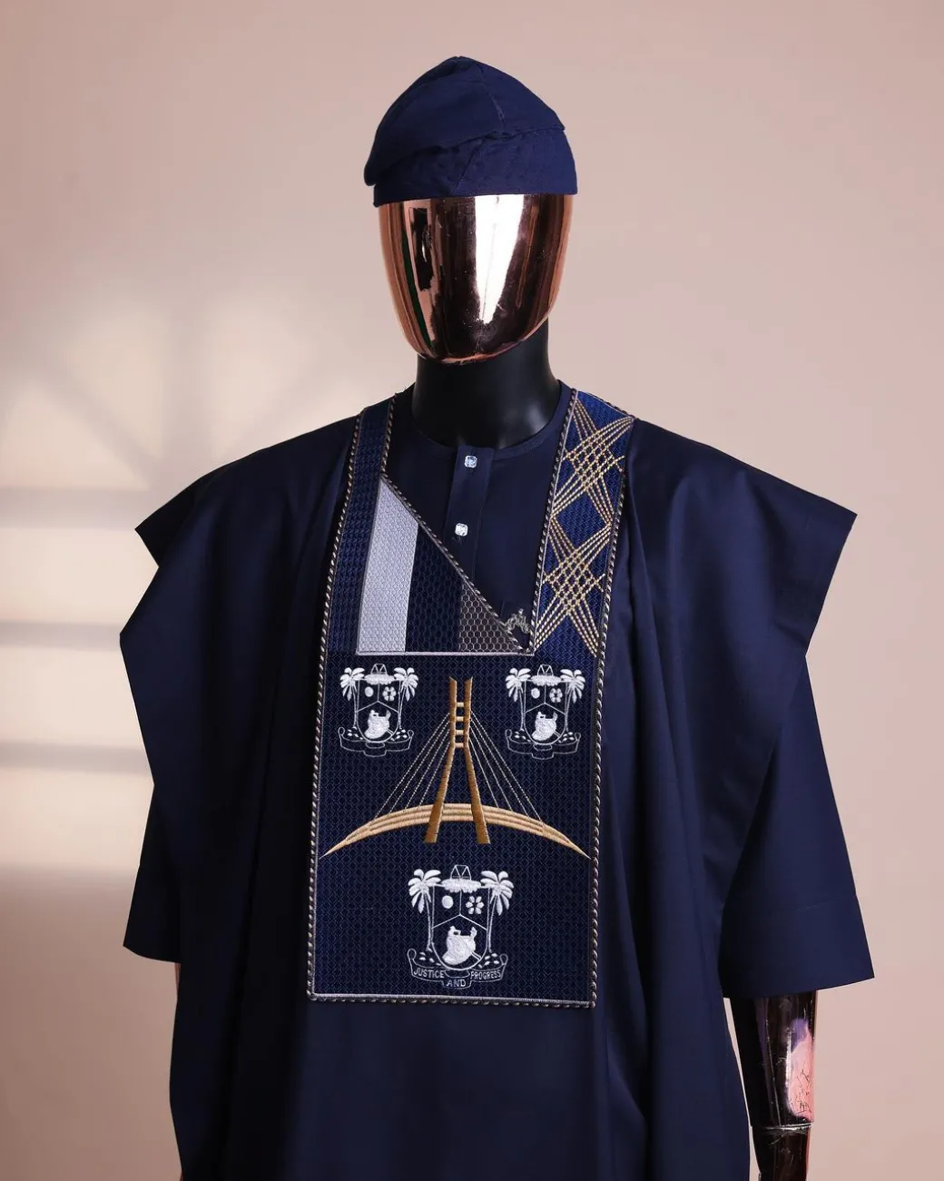 A Navy blue, “Eko Baje Ti – Lagos Will Never Spoil” embroidery details Agbada.