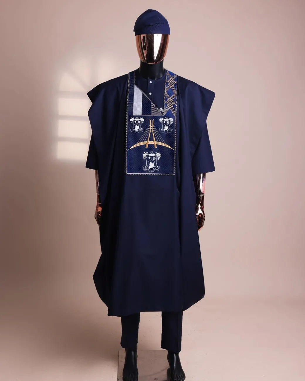 A Navy blue, “Eko Baje Ti – Lagos Will Never Spoil” embroidery details Agbada.