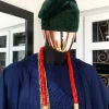A Navy Blue embroidery details Agbada and Hand Woven Army Green Velvet Yoruba Hat and sokoto
