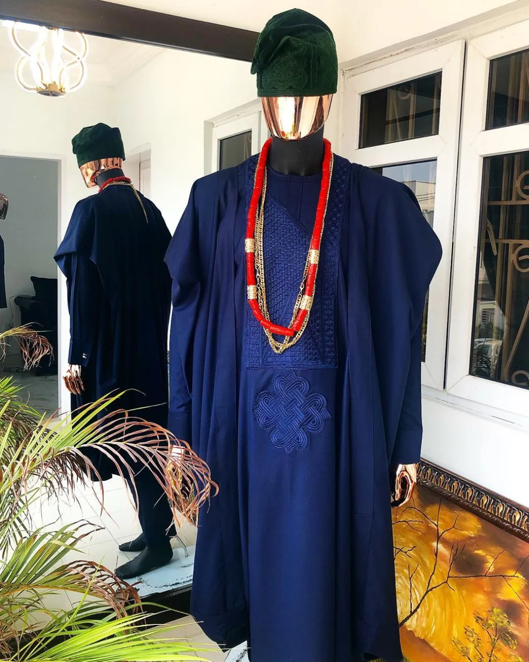 A Navy Blue embroidery details Agbada and Hand Woven Army Green Velvet Yoruba Hat and sokoto