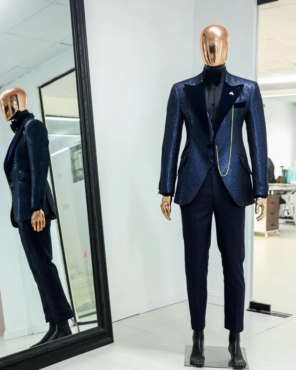 A Navy blue, floral pattern jacquard, peak lapel tuxedo suit