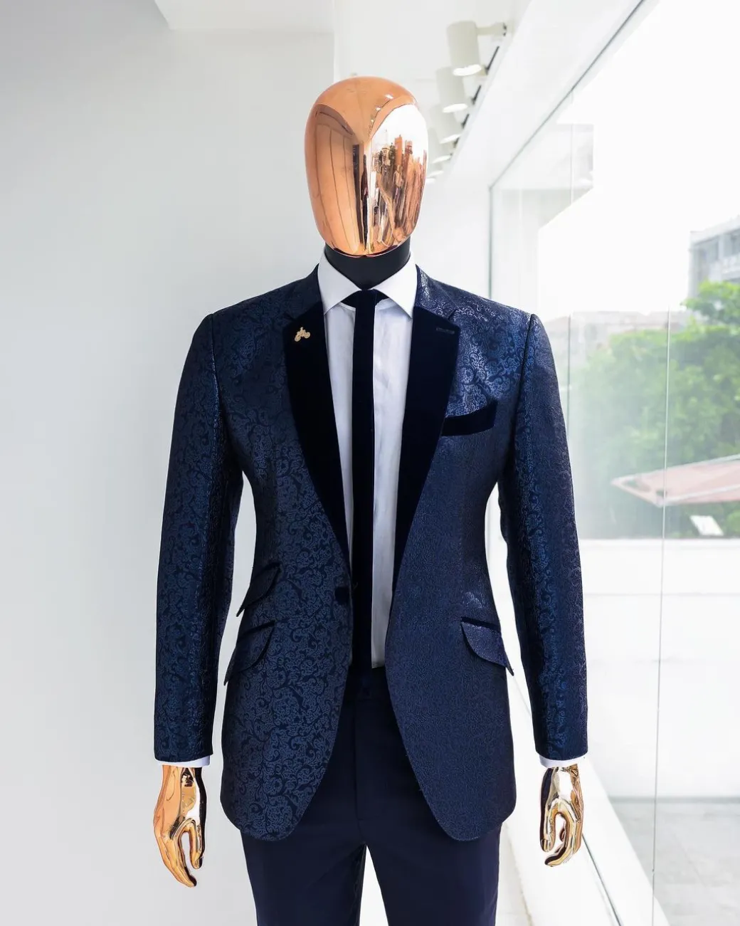 A Navy blue, floral pattern jacquard, slim notch lapel tuxedo suit