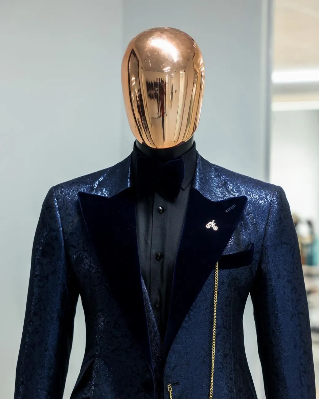 A Navy blue, floral pattern jacquard, peak lapel tuxedo suit