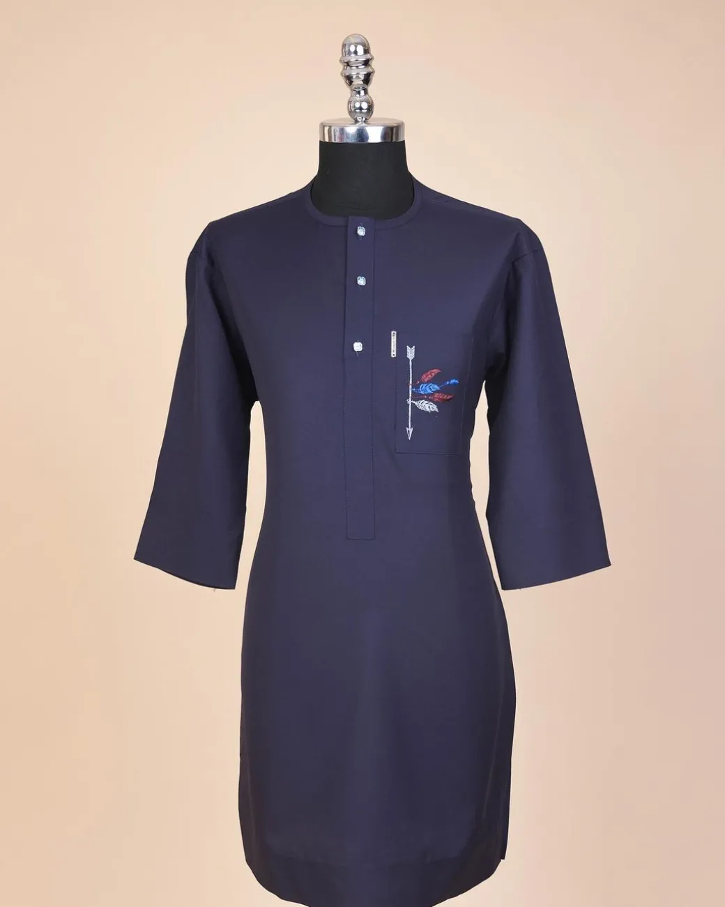 A navy blue, front flap with crystal blue Swarovski button, arrow and floral embroidery 3/4 sleeve African senator kaftan native.