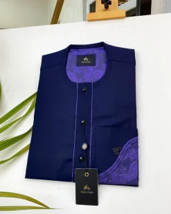 A Navy blue front flap with a clear view of the Swarovski and purple paisley African kaftan