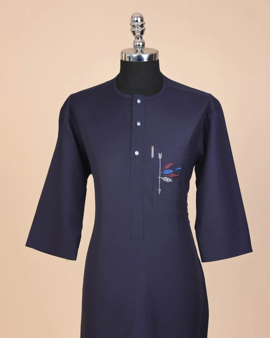 A navy blue, front flap with crystal blue Swarovski button, arrow and floral embroidery 3/4 sleeve African senator kaftan native.