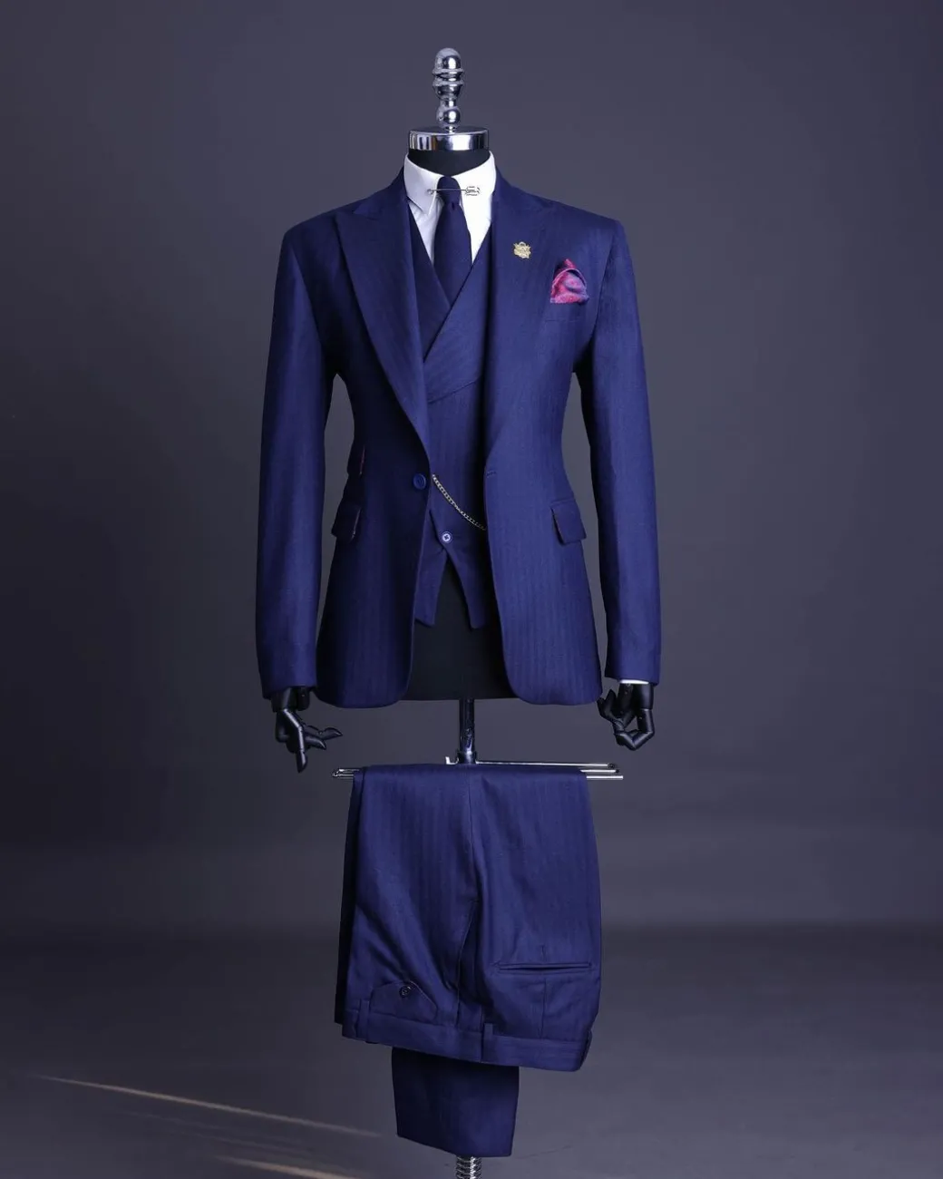 A Navy Blue, Herringbone Nobility Super “140s” “Board Room” Peak Lapel Suit