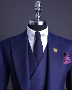 A Navy Blue, Herringbone Nobility Super “140s” “Board Room” Peak Lapel Suit