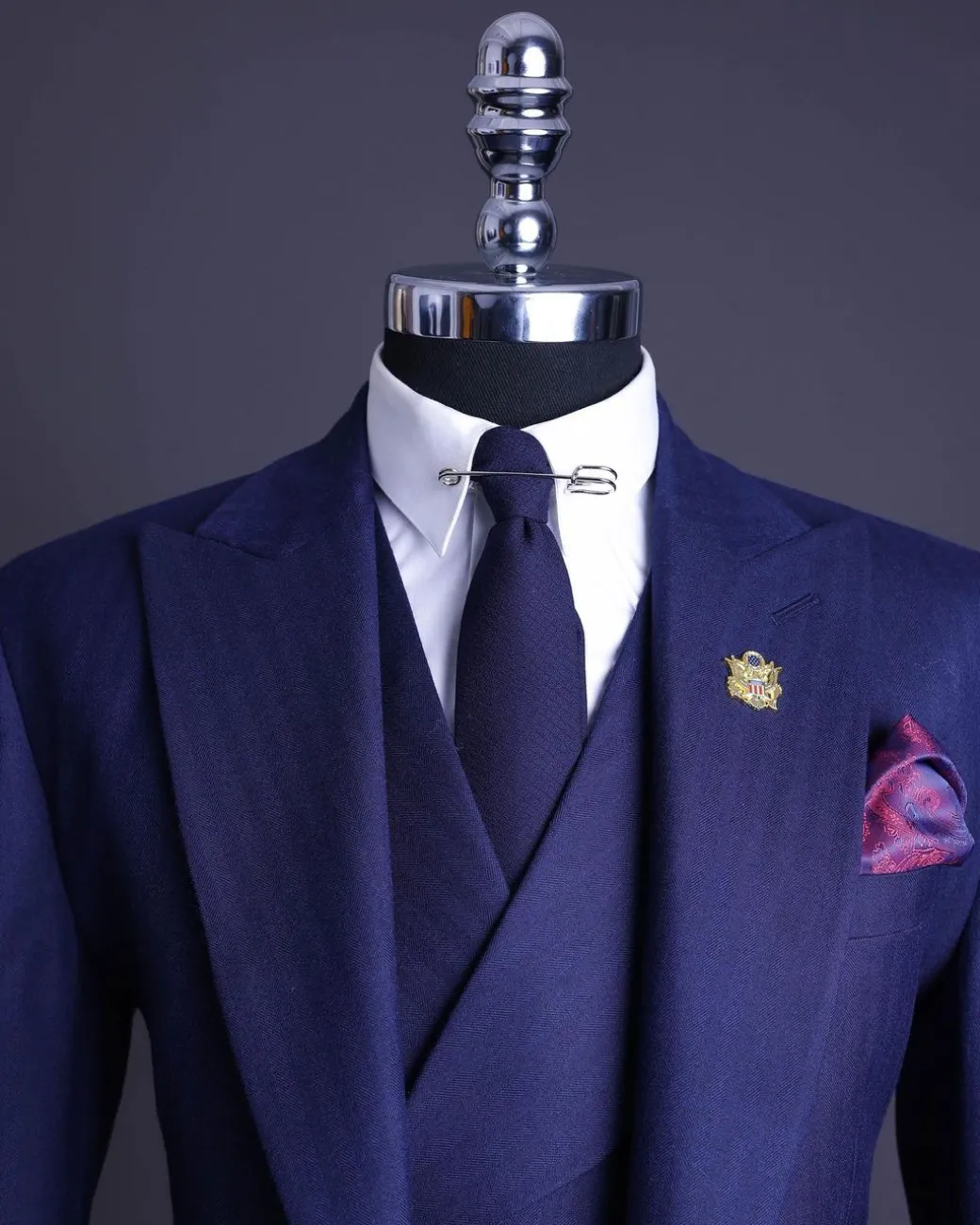 A Navy Blue, Herringbone Nobility Super “140s” “Board Room” Peak Lapel Suit