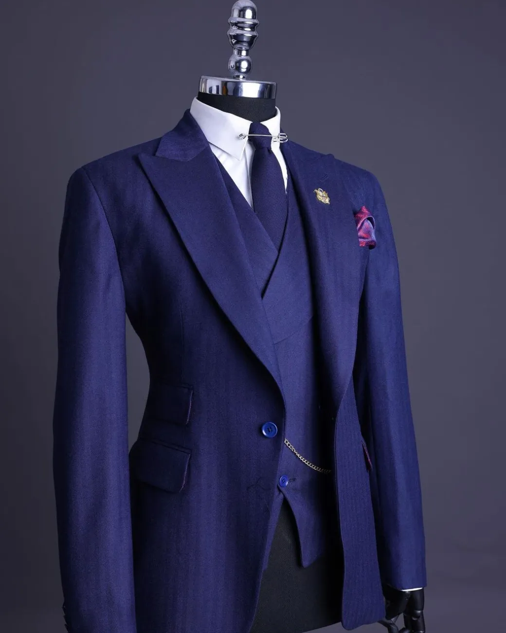 A Navy Blue, Herringbone Nobility Super “140s” “Board Room” Peak Lapel Suit