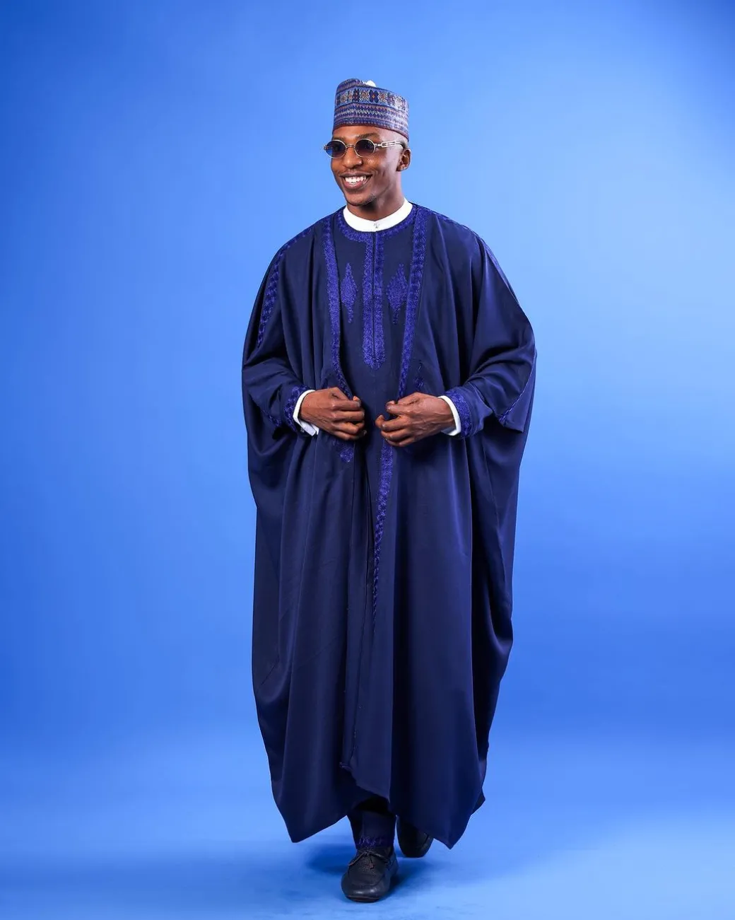 A Navy blue, “IBB”, arewa front cut, traditional detailing embroidery details tagbada
